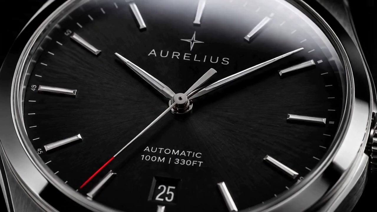 Aurelius — macro of the black sunburst dial, applied indices and red-tipped seconds hand